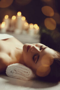 Relaxing massage in Auburn, AL with lit candles and soothing ambiance.