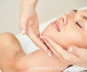 Facial massage at a spa in Auburn, AL, promoting relaxation and skincare rejuvenation.